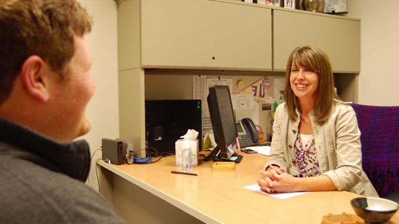 Counseling Services member with student in office